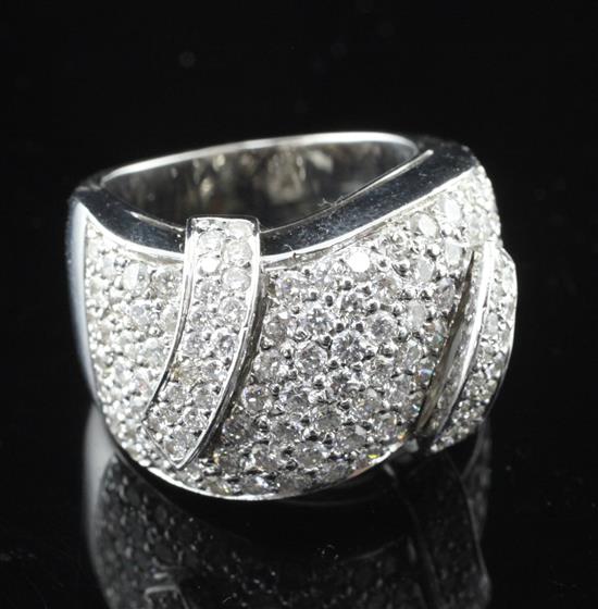 A modern 18ct white gold and pave set diamond dress ring, size L.